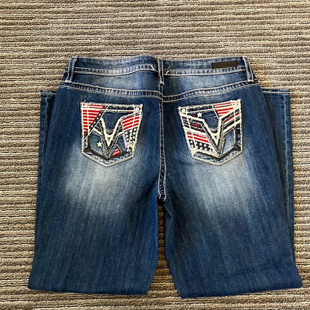 Maurice’s blue denim with red white and blue pocket flare jeans
